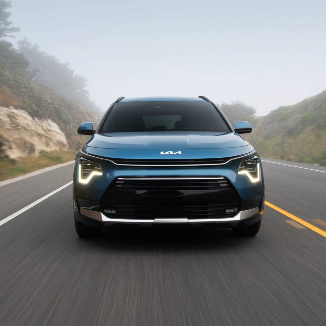 2024 Kia Niro Plug-In Hybrid Accelerating Fast On An Empty Foggy Road Front-View