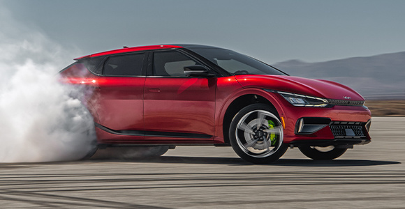 2024 Kia EV6 Utilizing Electronically Controlled Suspension And Its Electronic Limited Slip Differential To Make Sharp Turns On An Empty Lot